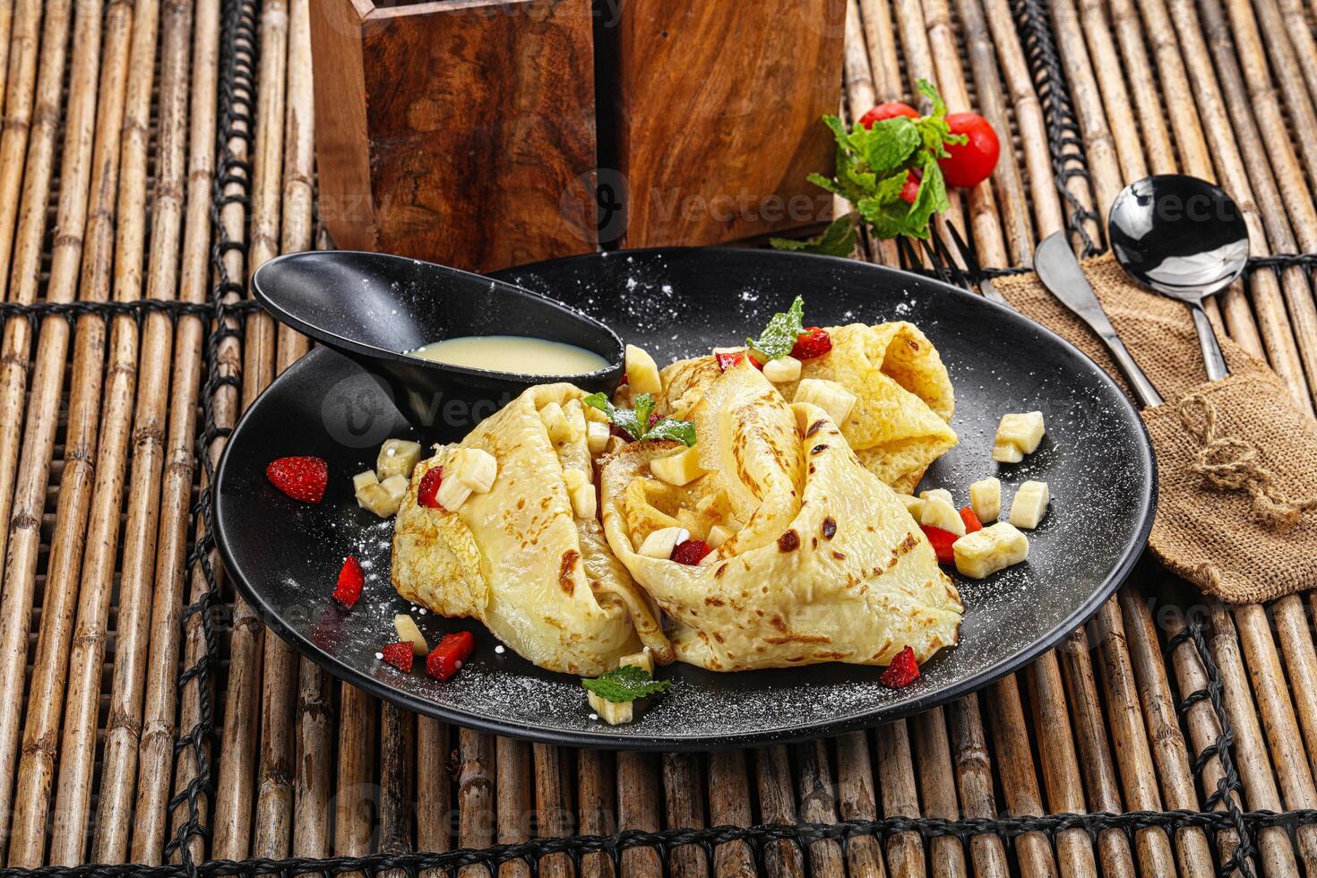Sweet banana pancake with honey photo