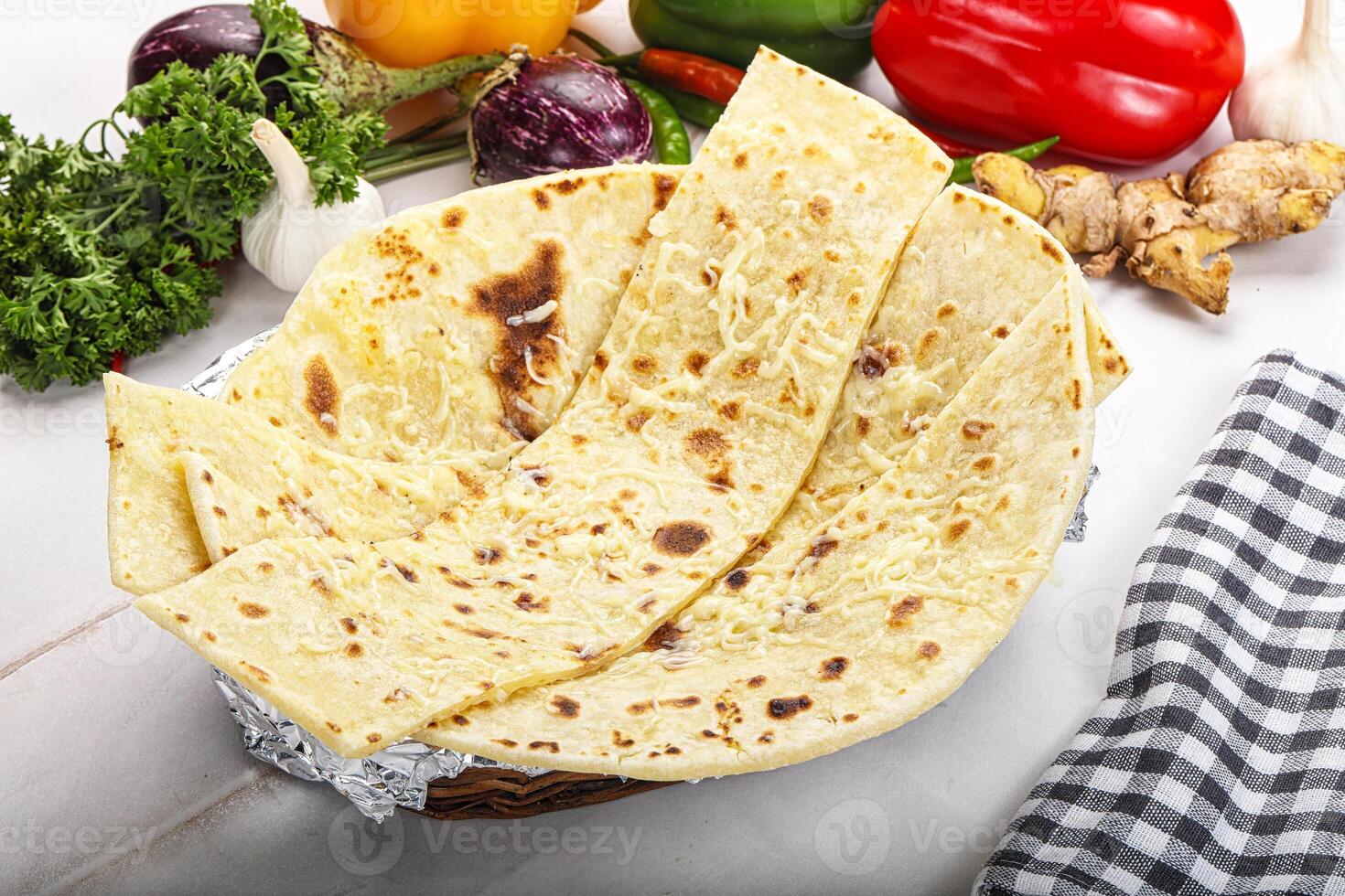 Indian bread cheese garlic naan photo