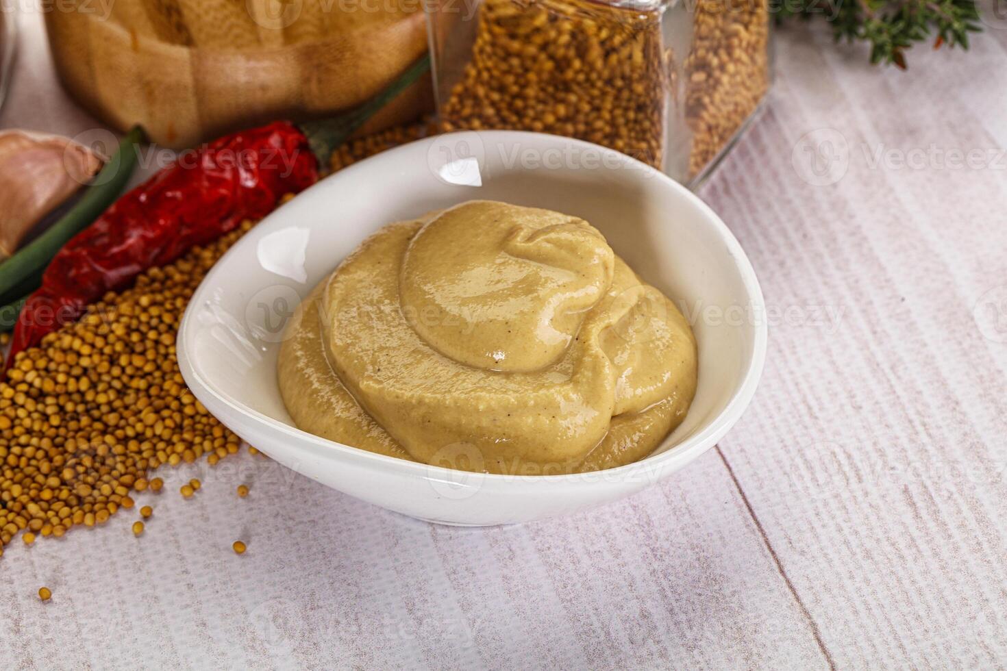 Dijon mustard sauce in the bowl photo