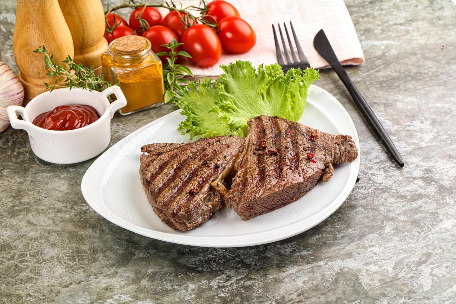 Delicus grilled beef steak with sauce photo