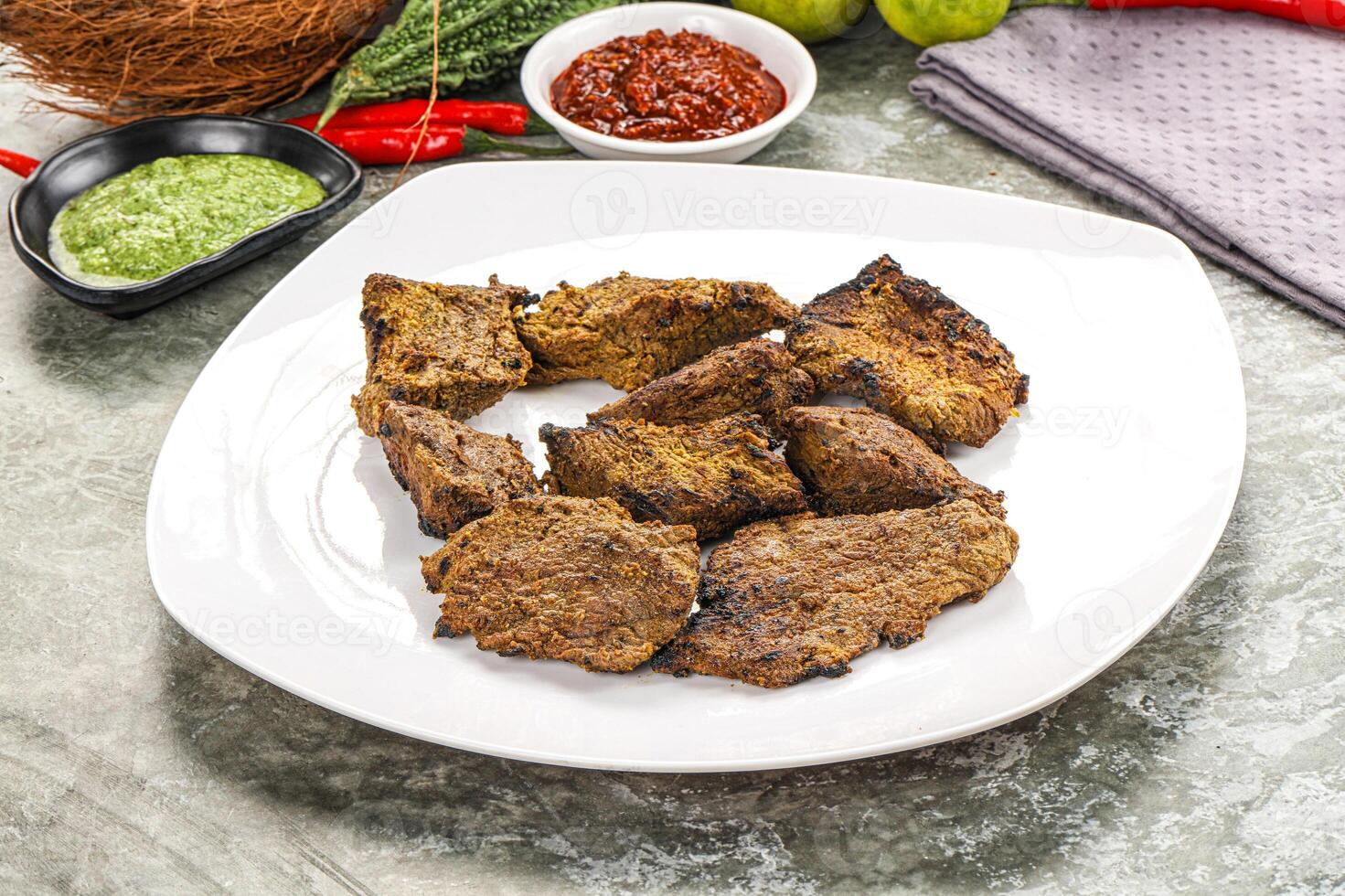 Grilled beef barbecue with spises photo