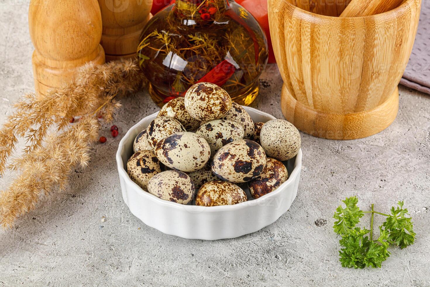 Raw quail egg in the bowl photo