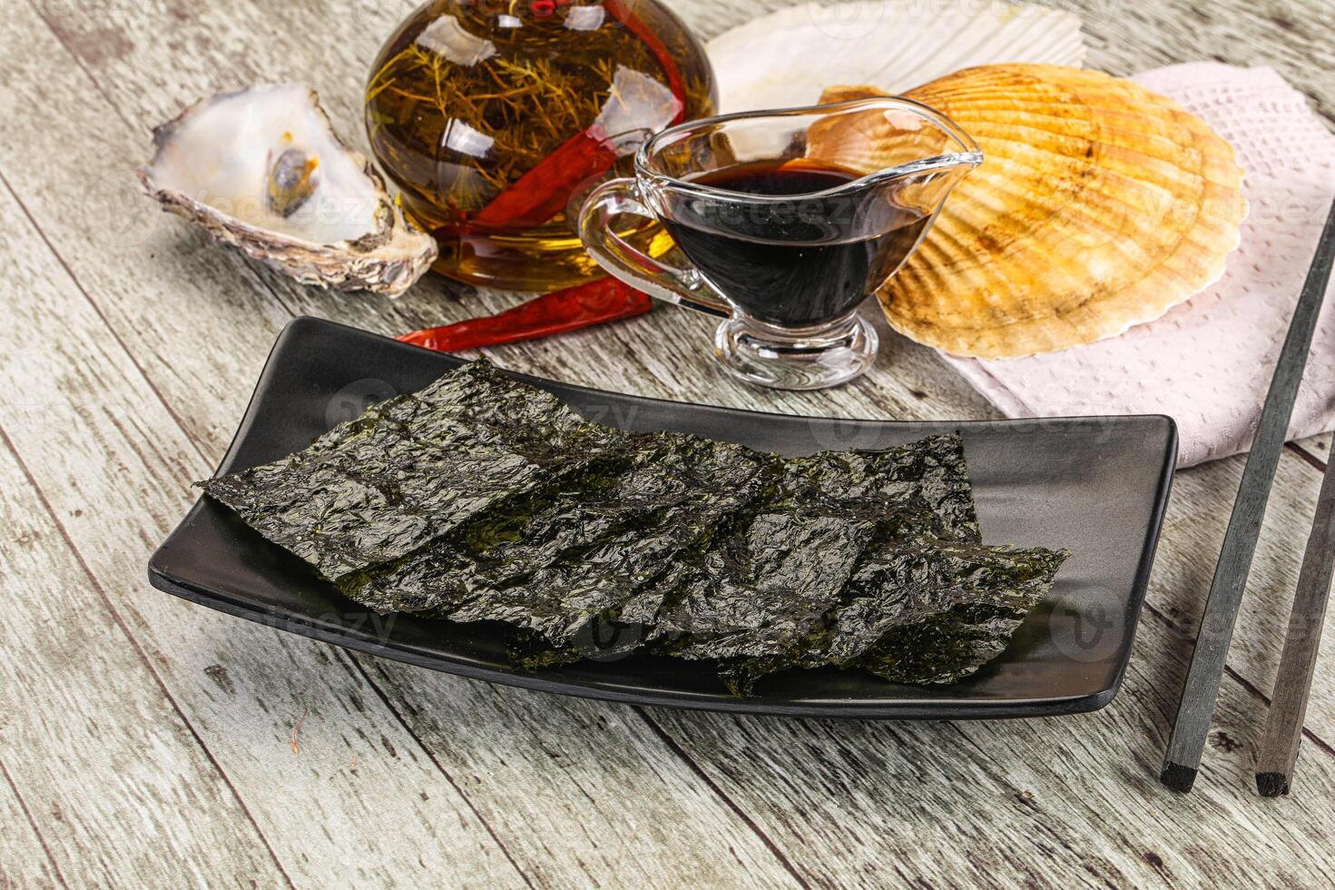 Green nori seaweed chips with soya sauce photo