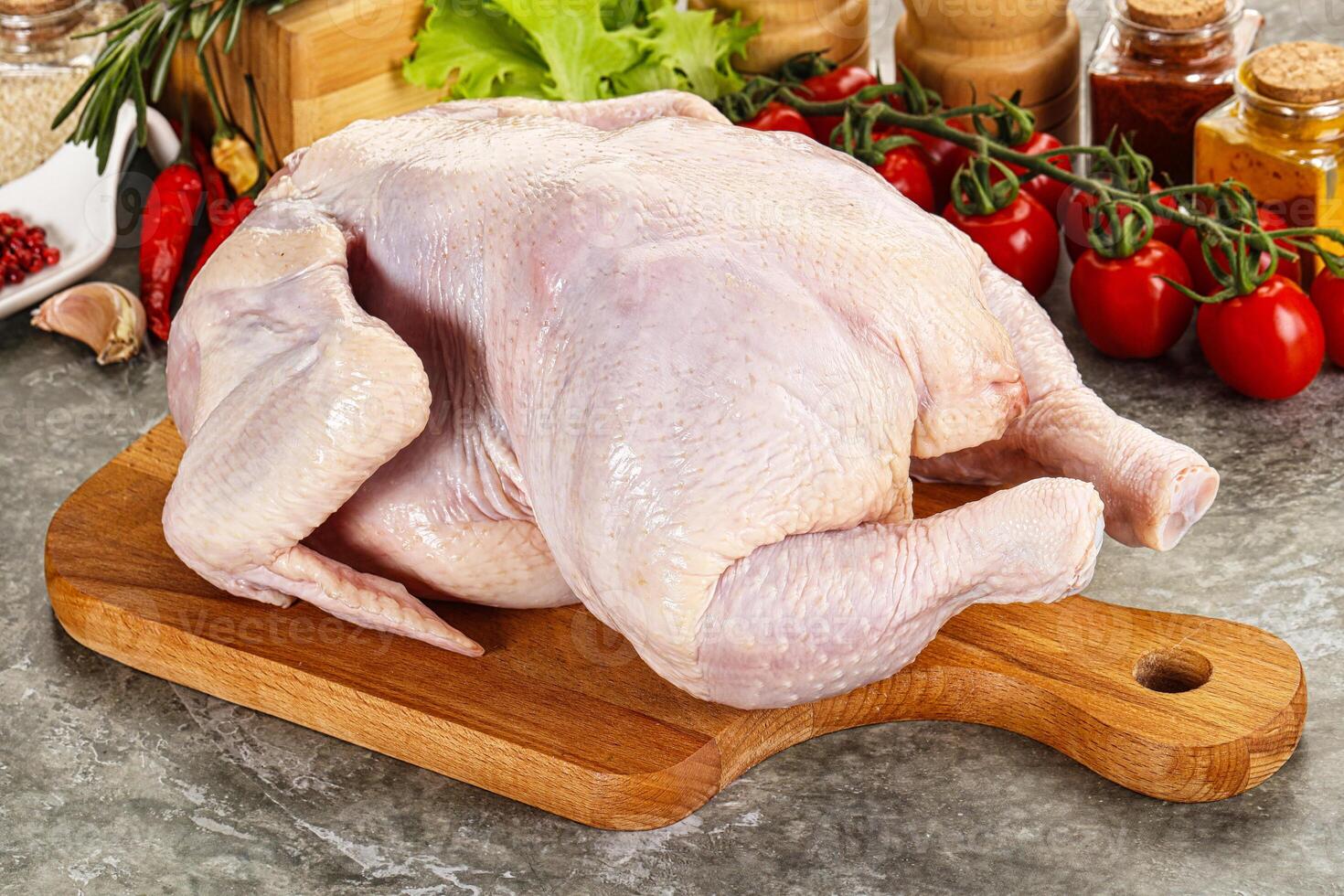 Raw whole chicken for cooking photo