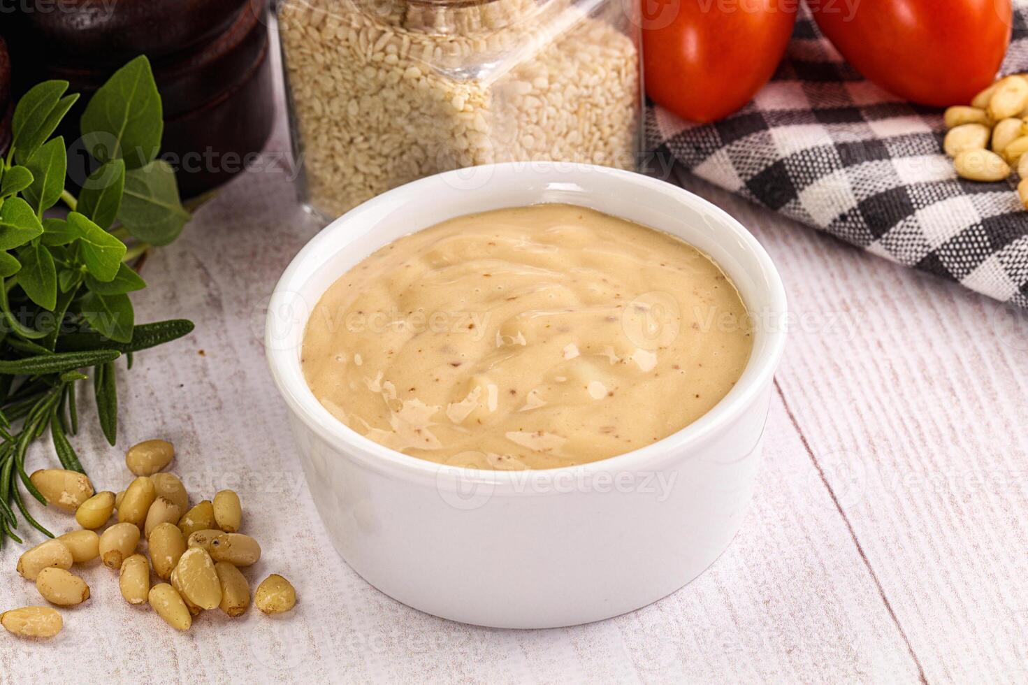 Delicious walnut creamy sauce in the bowl photo