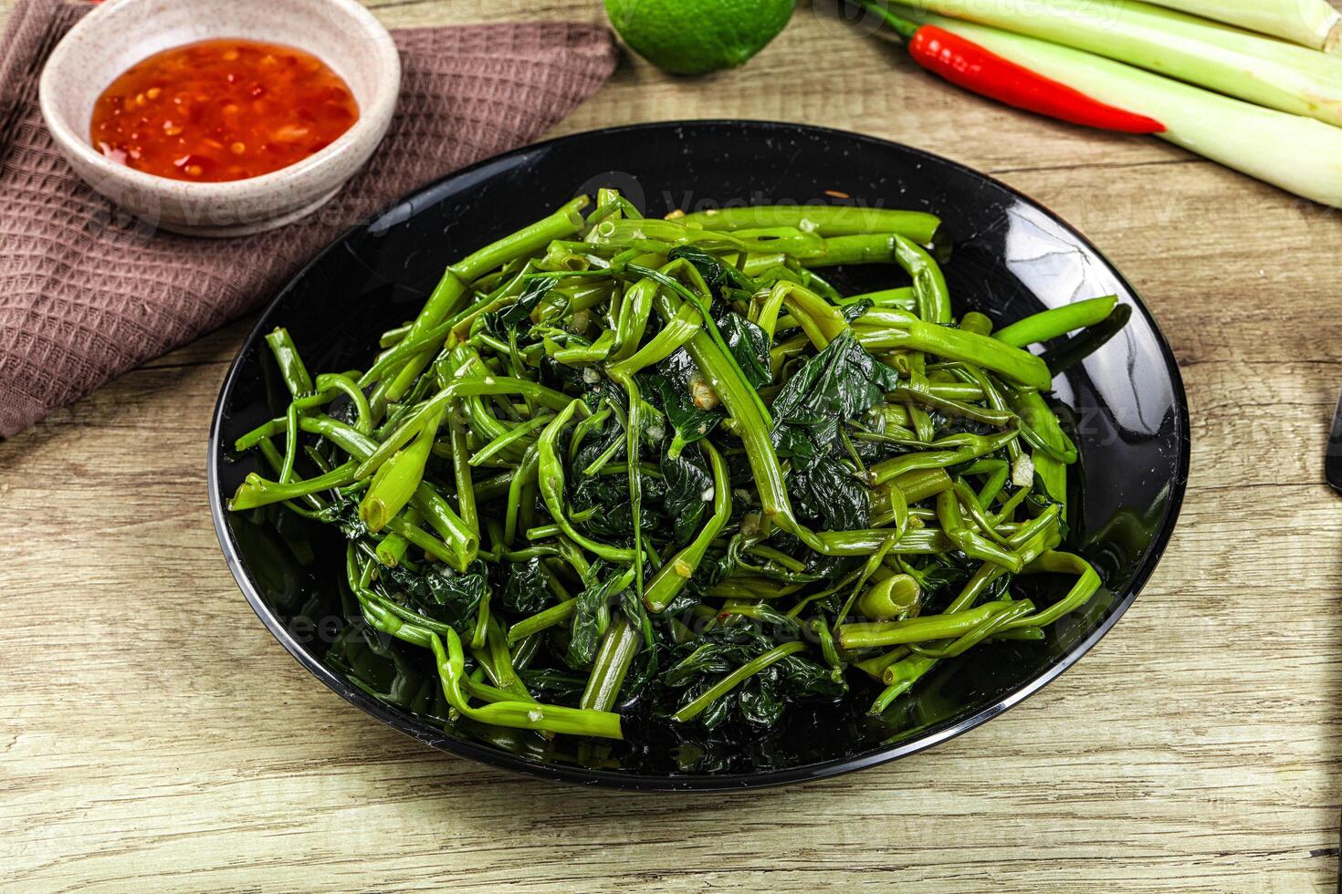 Asian cuisine stir fried morning glory photo