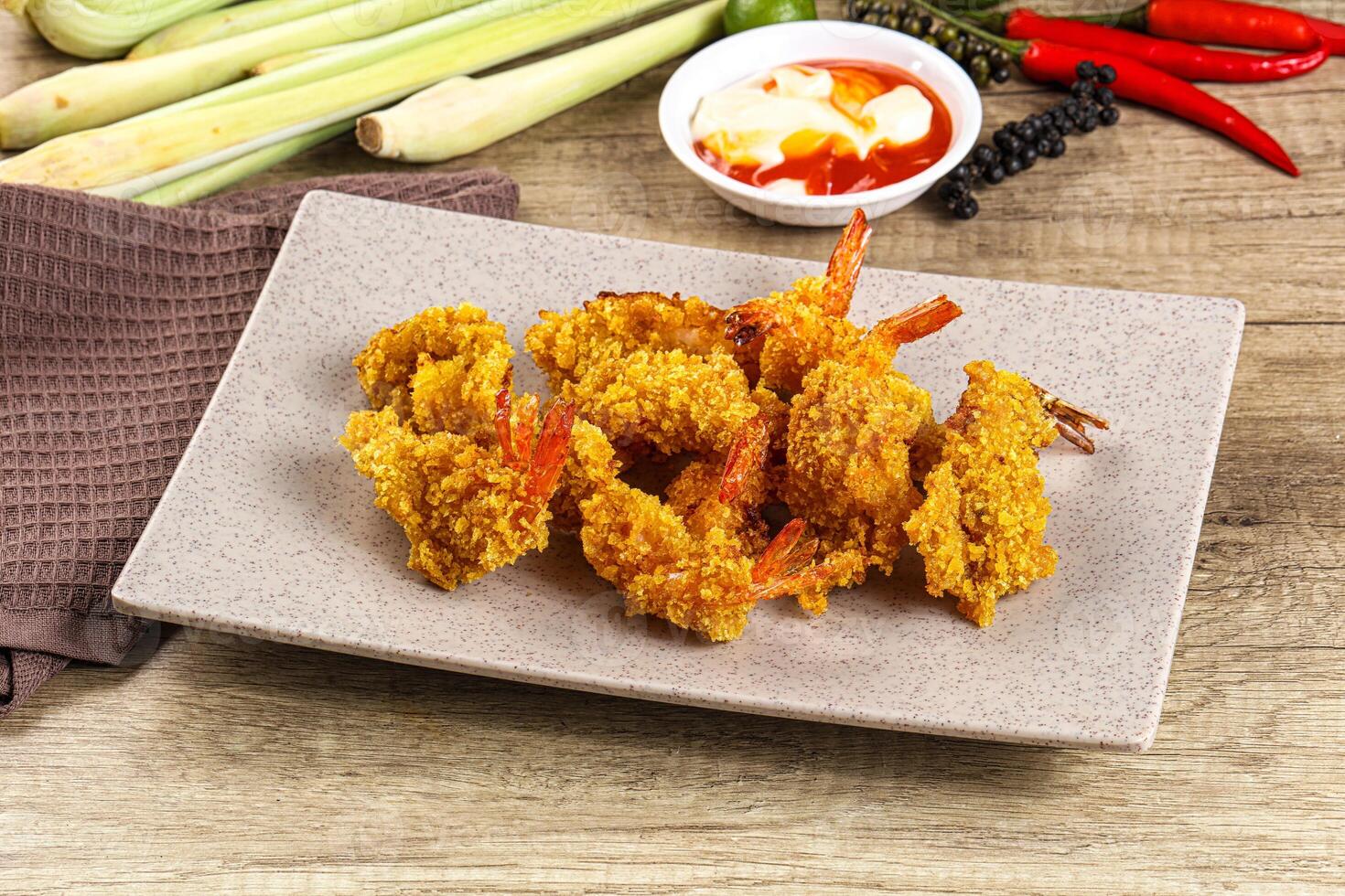 Golden deep prawn tempura wuth sauce photo