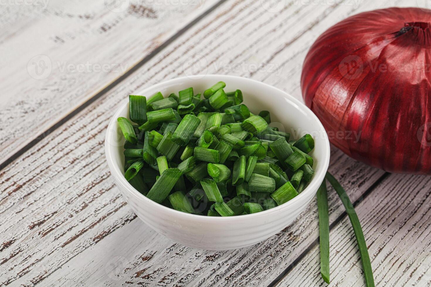 Diced green onion in the bowl photo