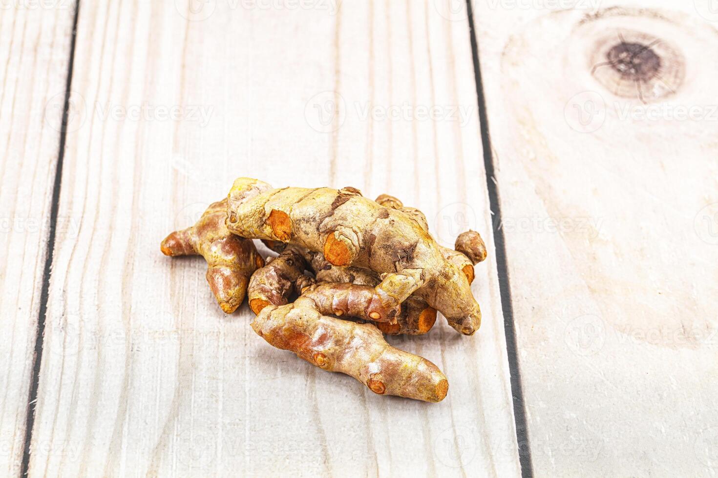 Fresh young Tumeric root heap photo
