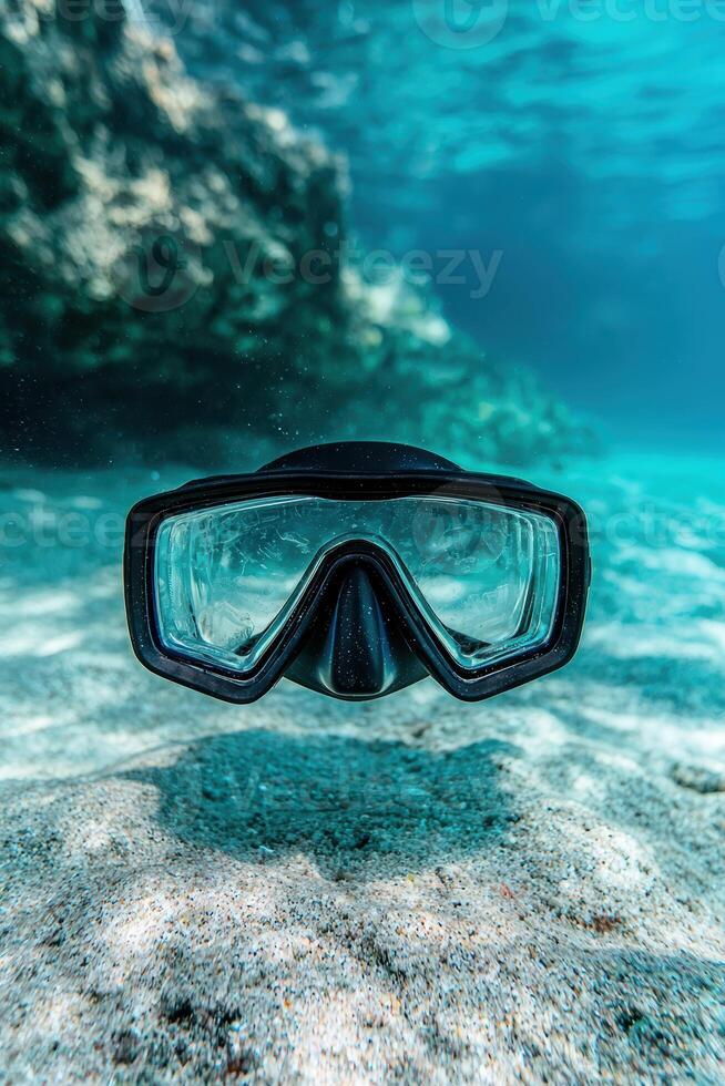 Diving mask underwater with coral reef photo