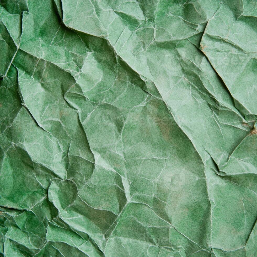 crumpled green paper texture background photo