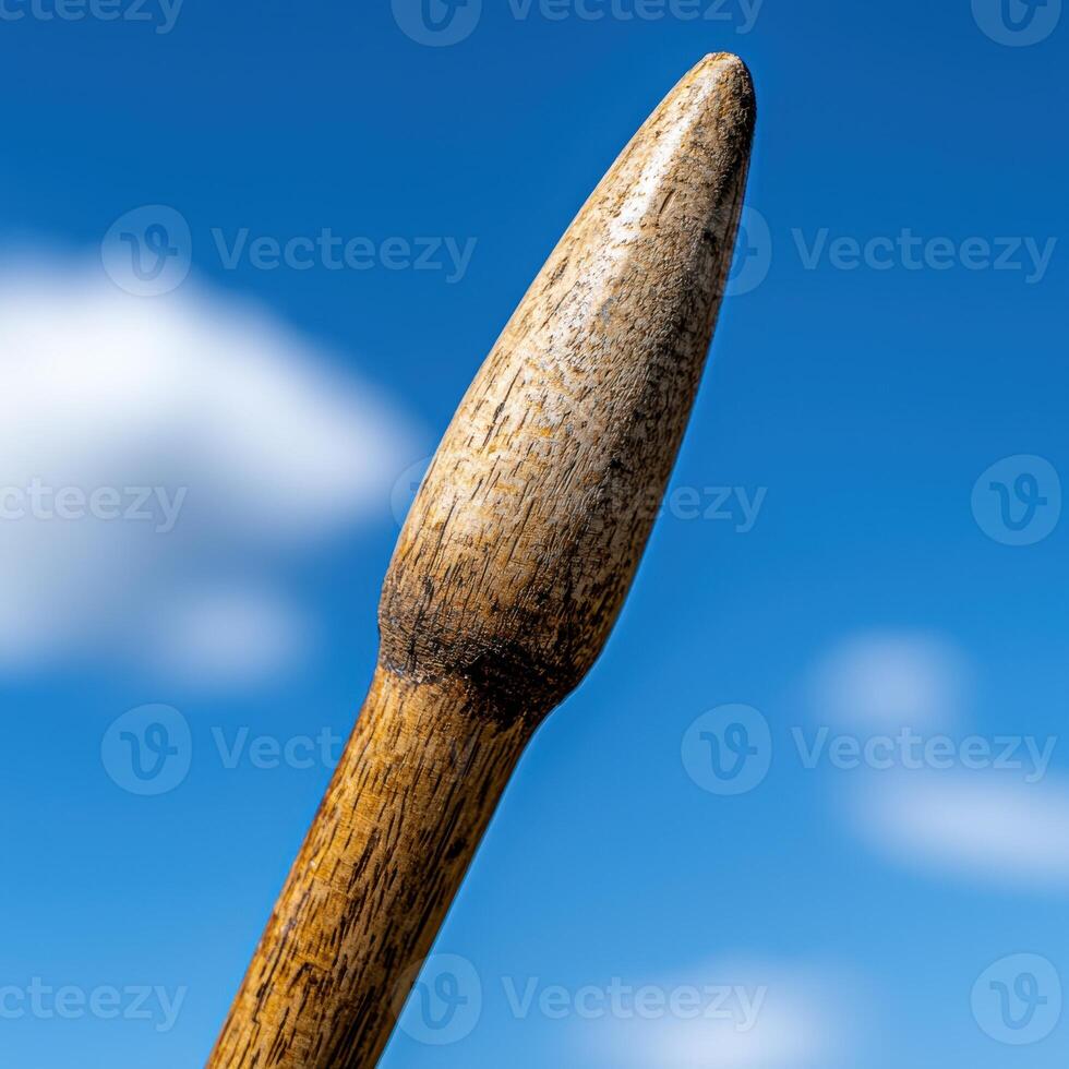 Wooden stick against blue sky photo