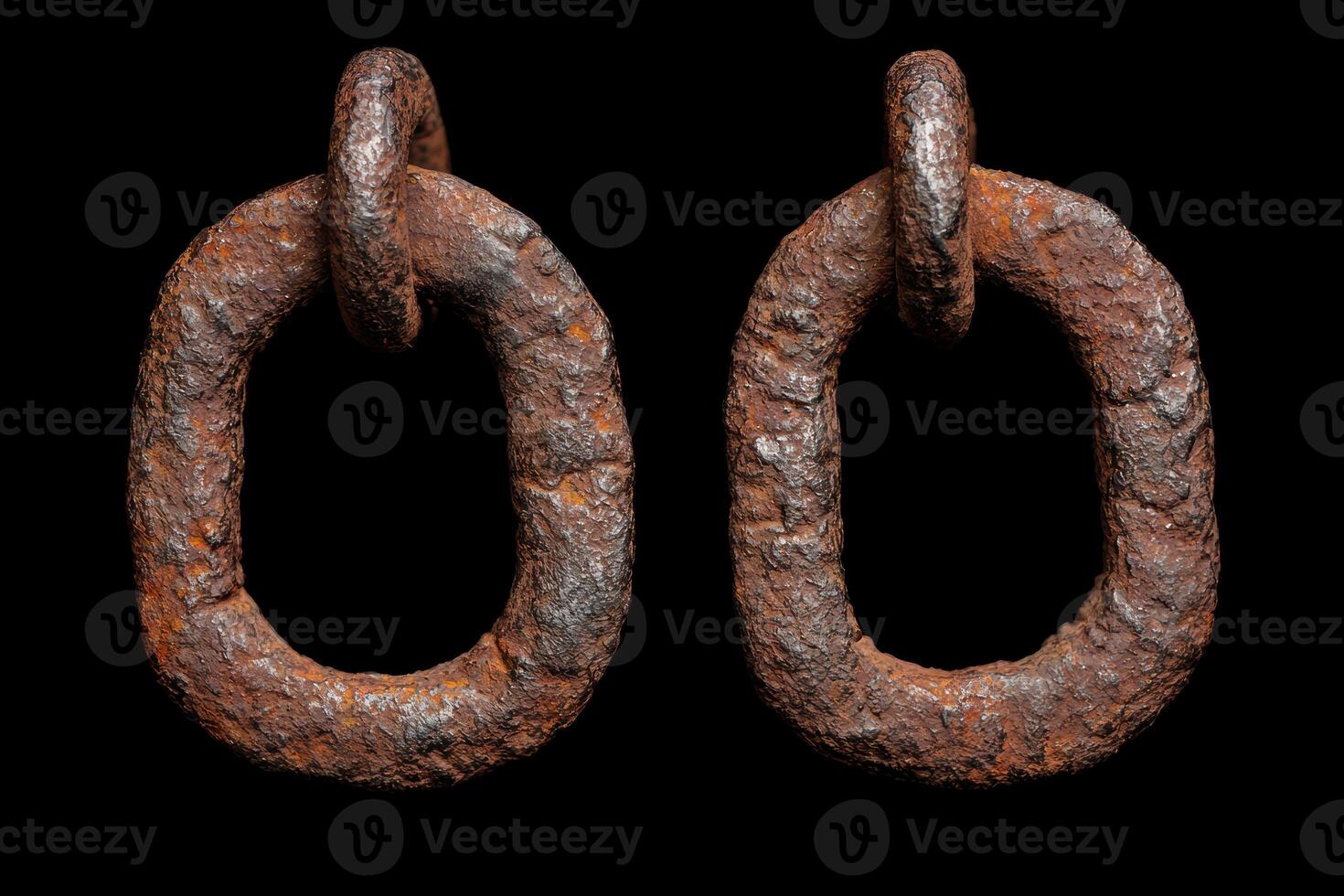 Rusty metal rings on black background photo