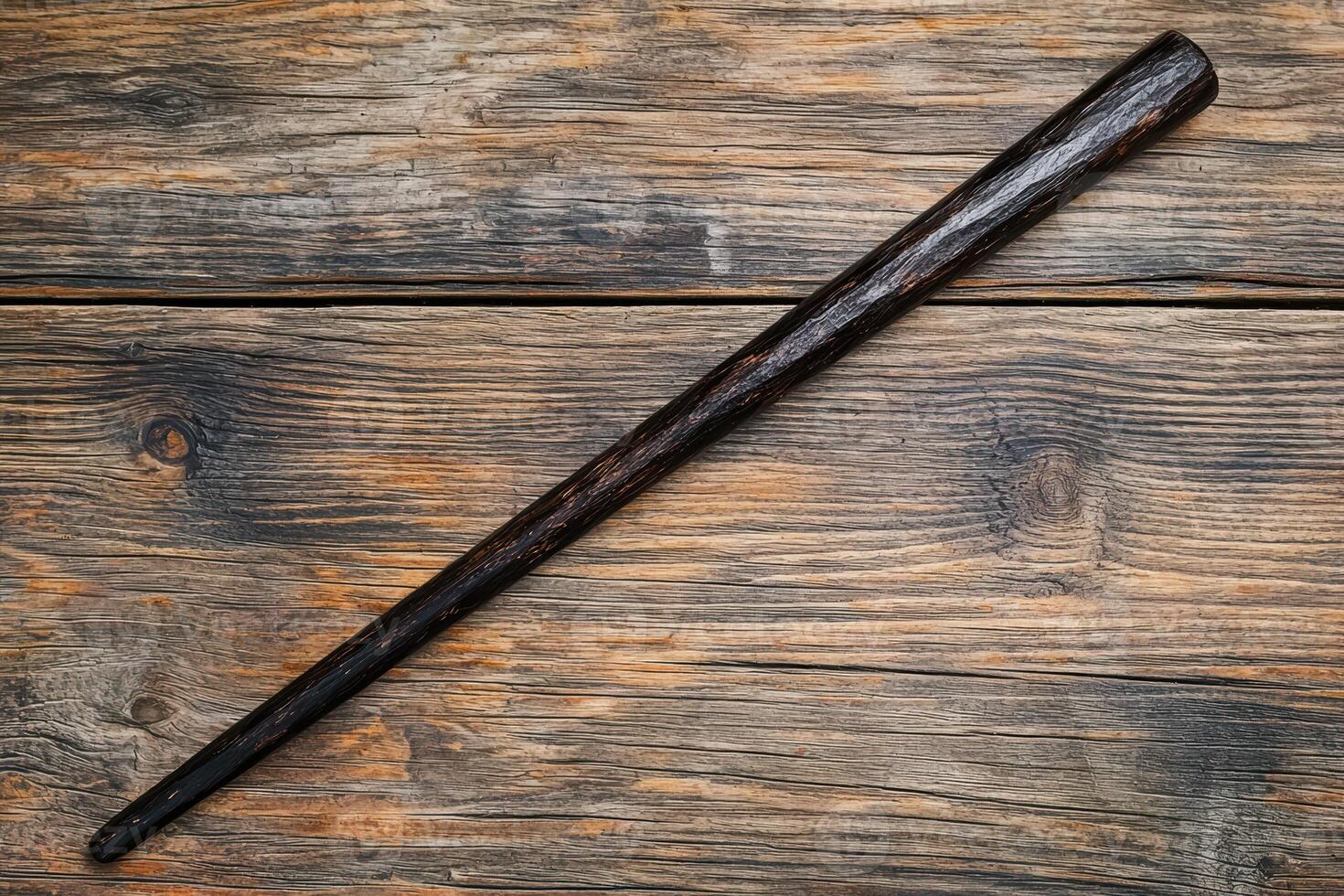 Wooden baseball bat on rustic wooden background photo
