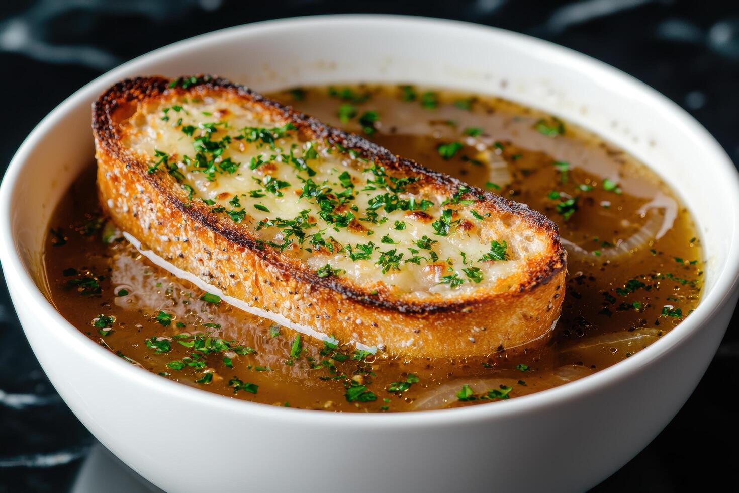 Delicious french onion soup with croutons and parsley photo