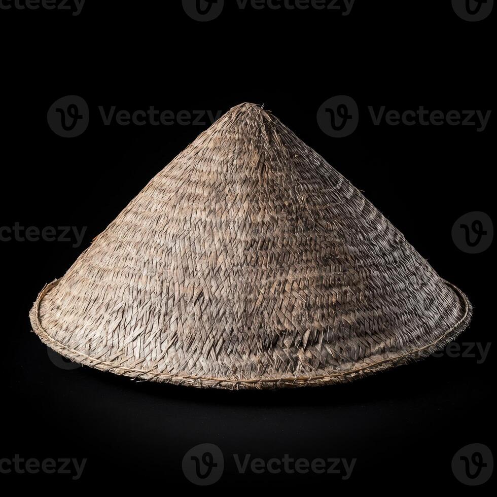 Woven straw hat on black background photo