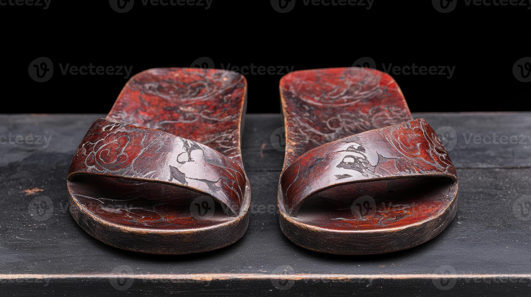Decorative wooden sandals with floral patterns photo
