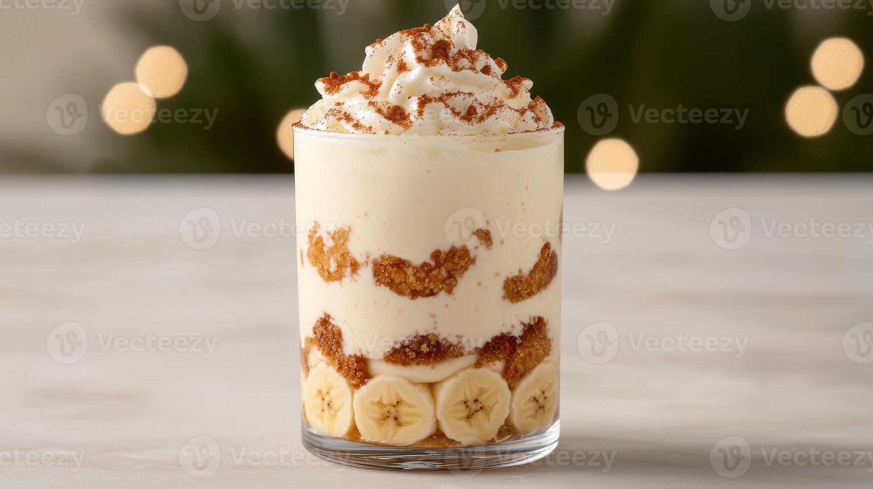 Delicious banana pudding dessert with whipped cream and crumbled cookies photo