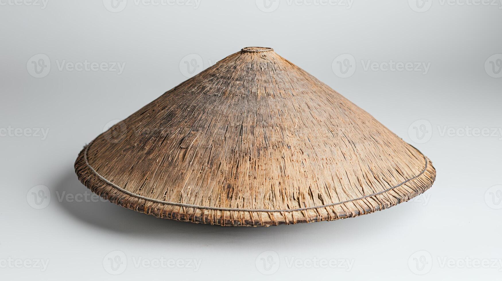 Woven straw hat or conical asian hat photo