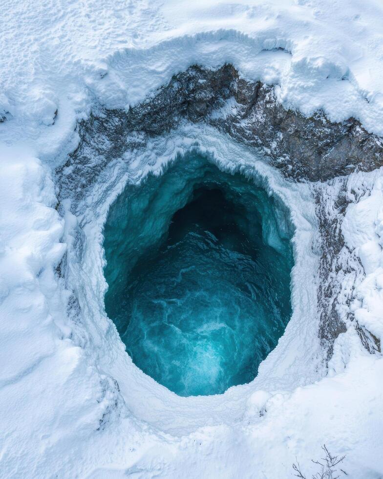 Breathtaking ice cave in snowy winter landscape photo