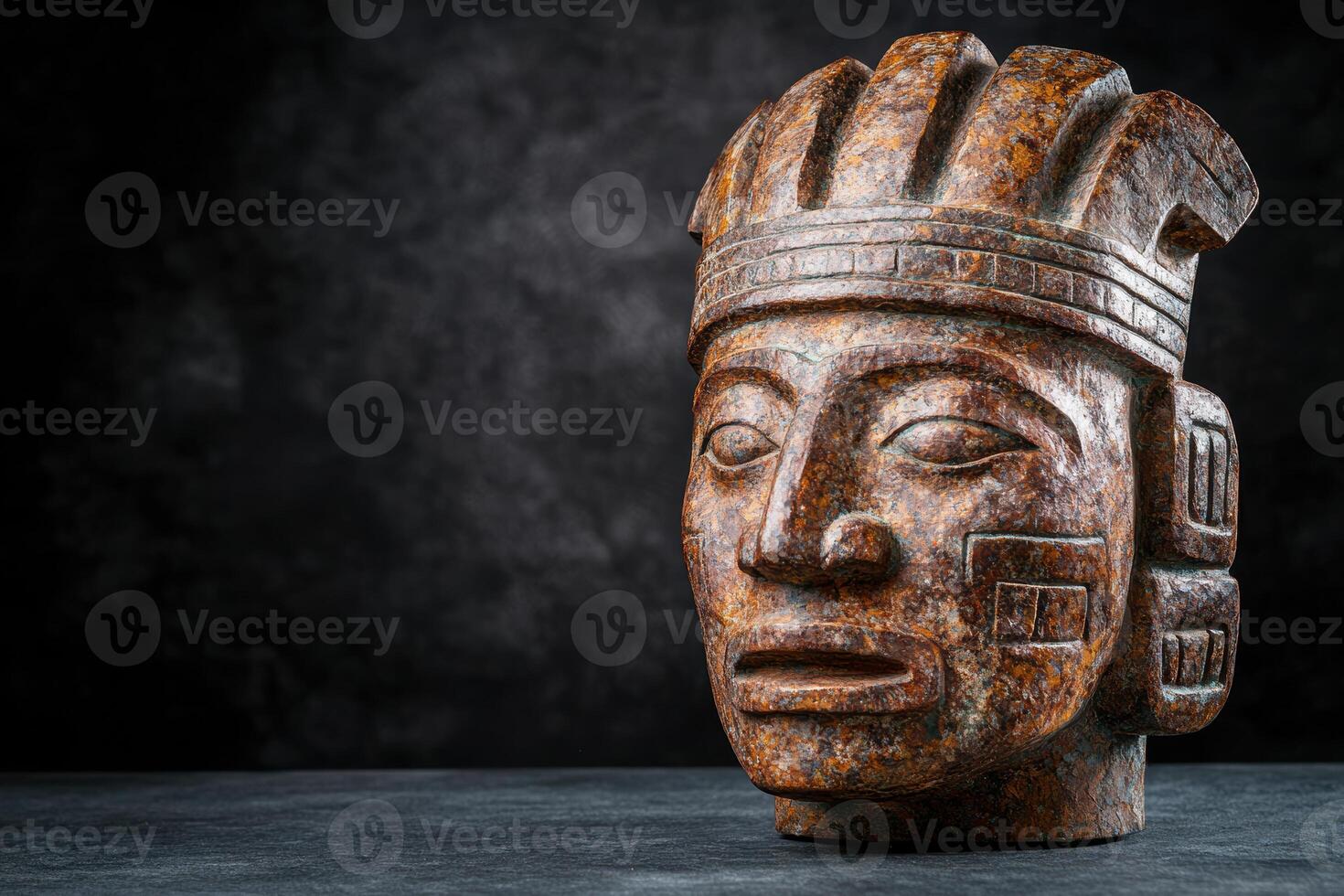 Weathered stone sculpture of an ancient figure photo