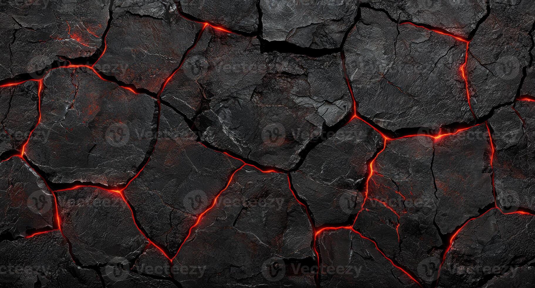 Glowing molten lava cracks in dark volcanic rock photo