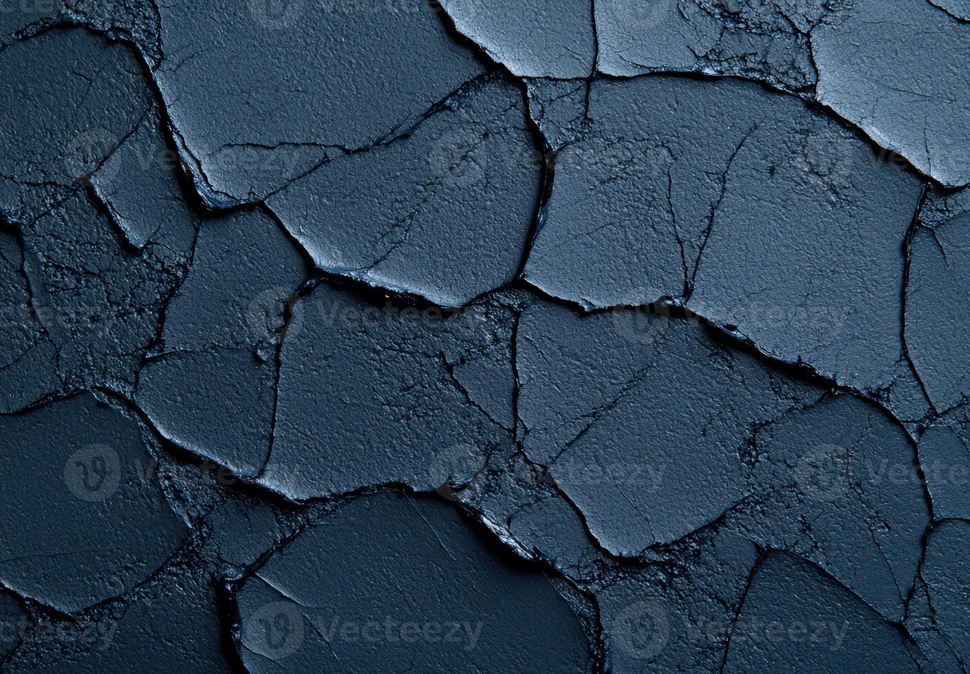 Cracked black asphalt surface texture photo
