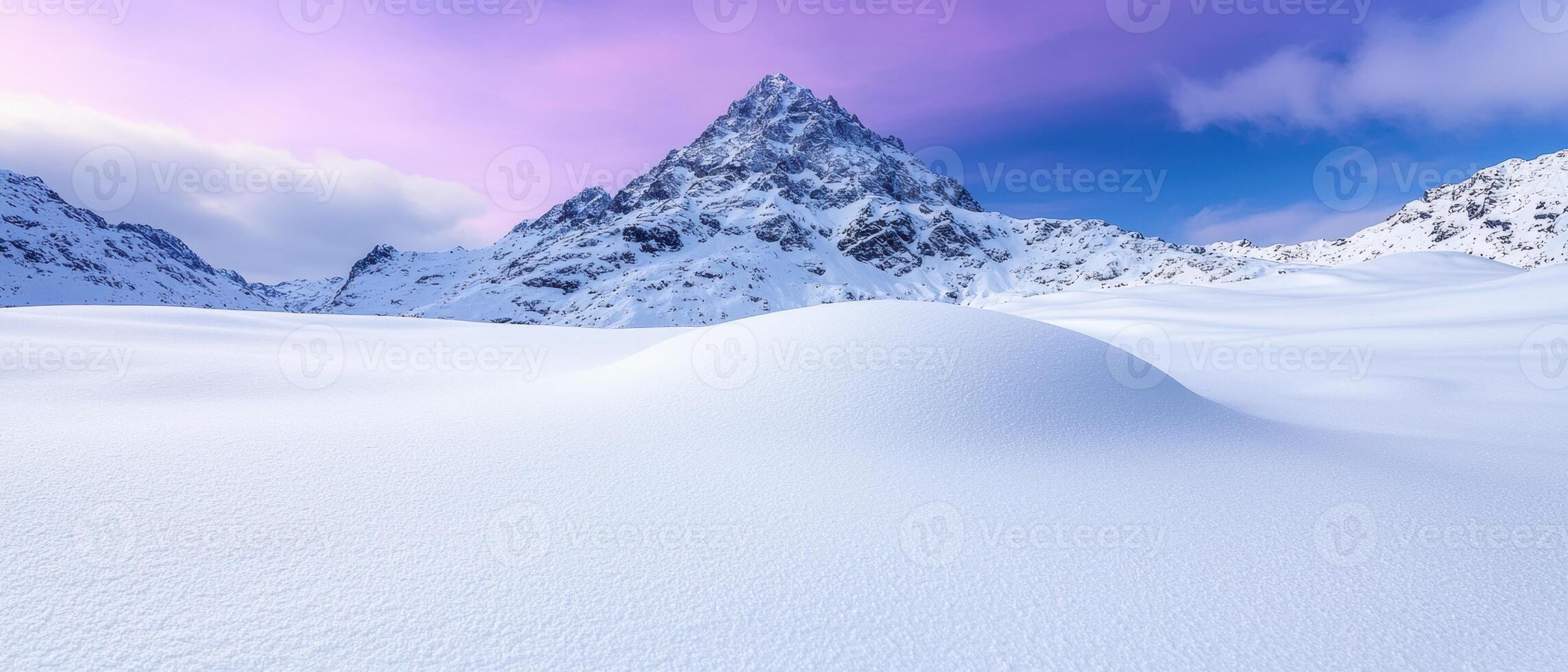 Snowy mountain landscape at sunset photo