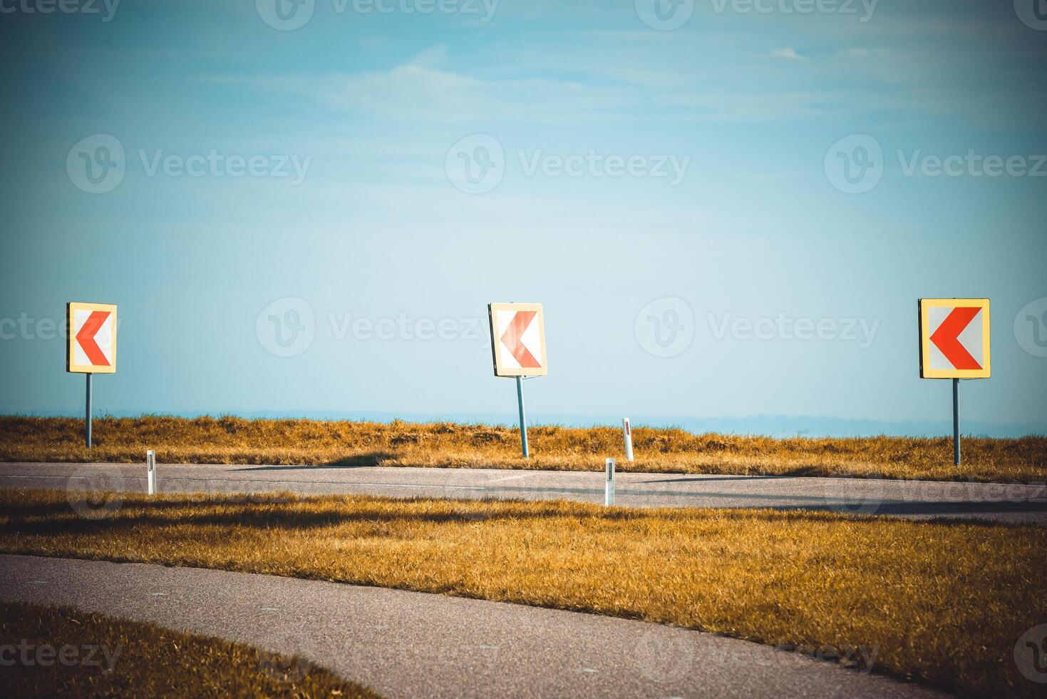 Turn left sign on a country road photo