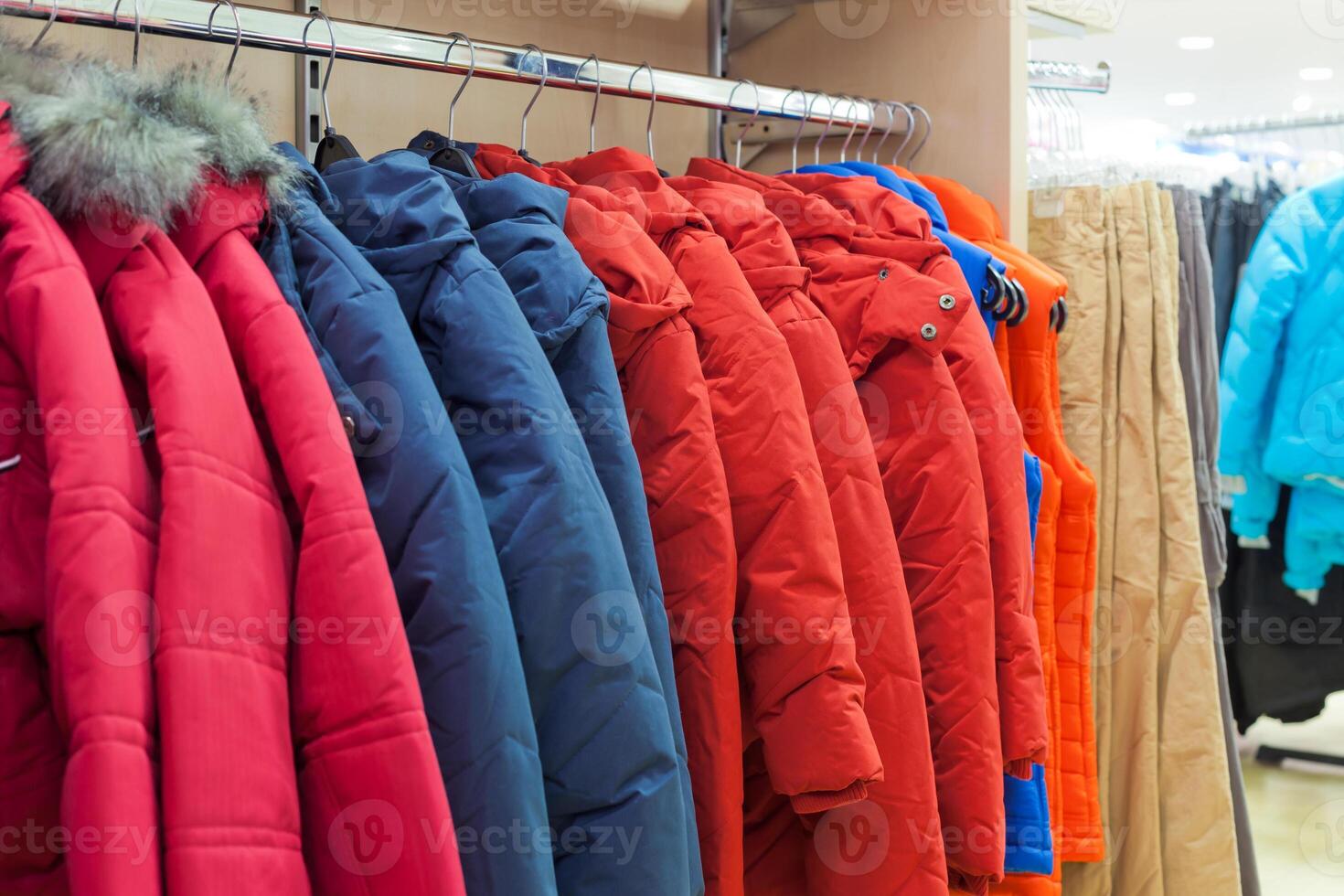 Winter clothes hanging at a store photo
