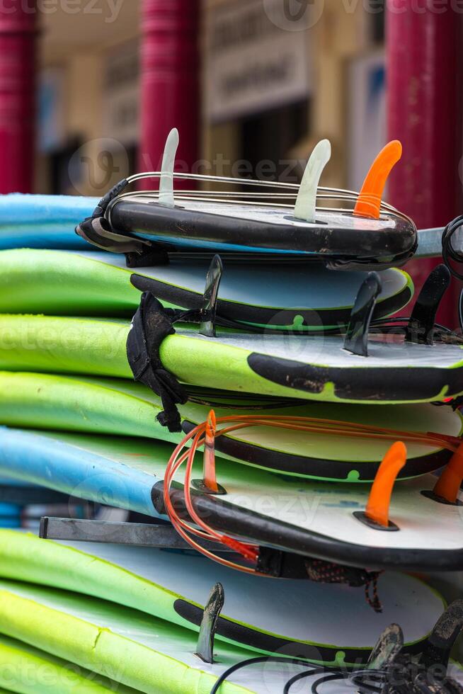 Surf boards in a stack photo