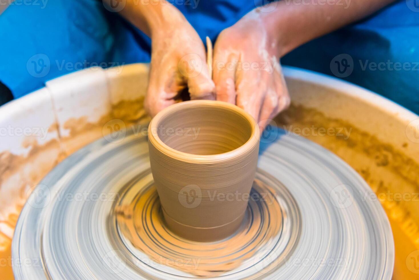 Pottering - creating a clay cup in process photo