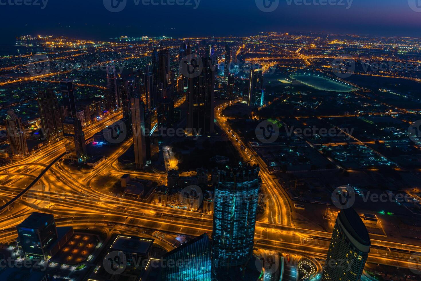 Dubai downtown night scene with city lights photo