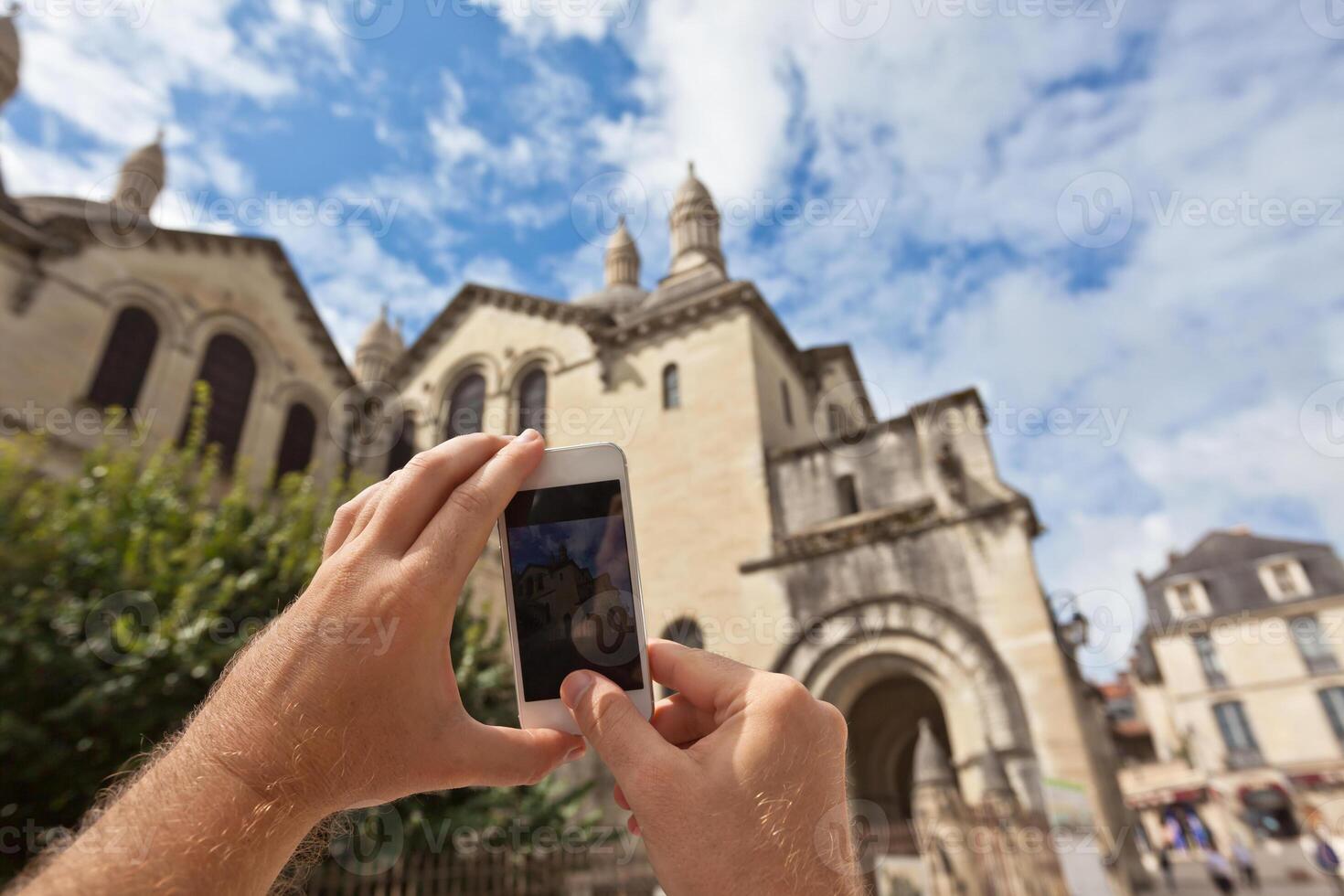 Tourist taking photo of Perigueux, France