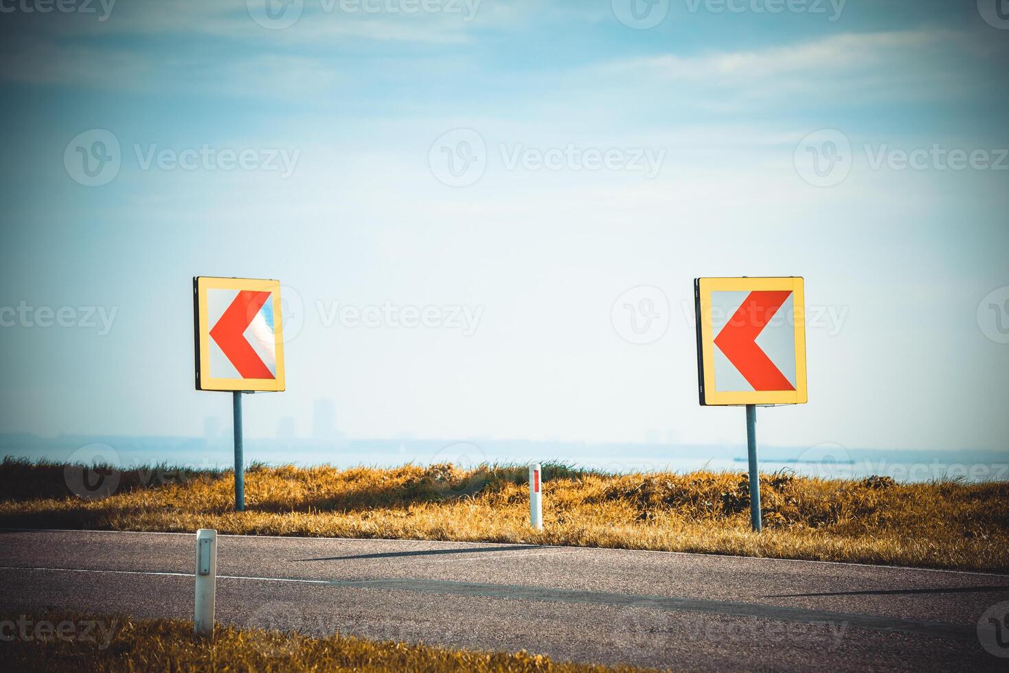 Turn left sign on a country road photo