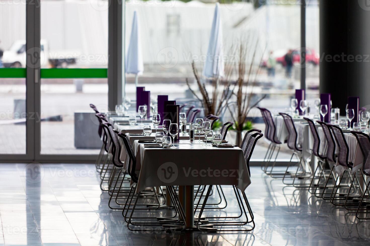 Indoor restaurant tables ready for service photo
