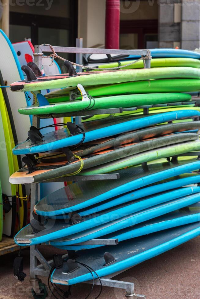 Surf boards in a stack photo