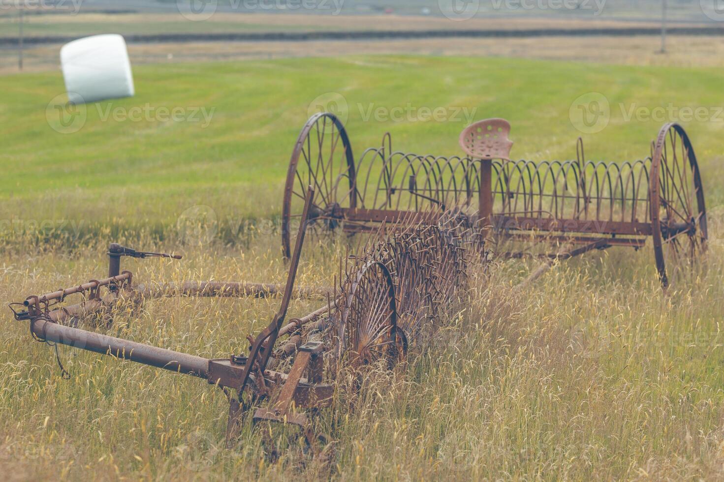 Rusty plows on a field of Iceland photo