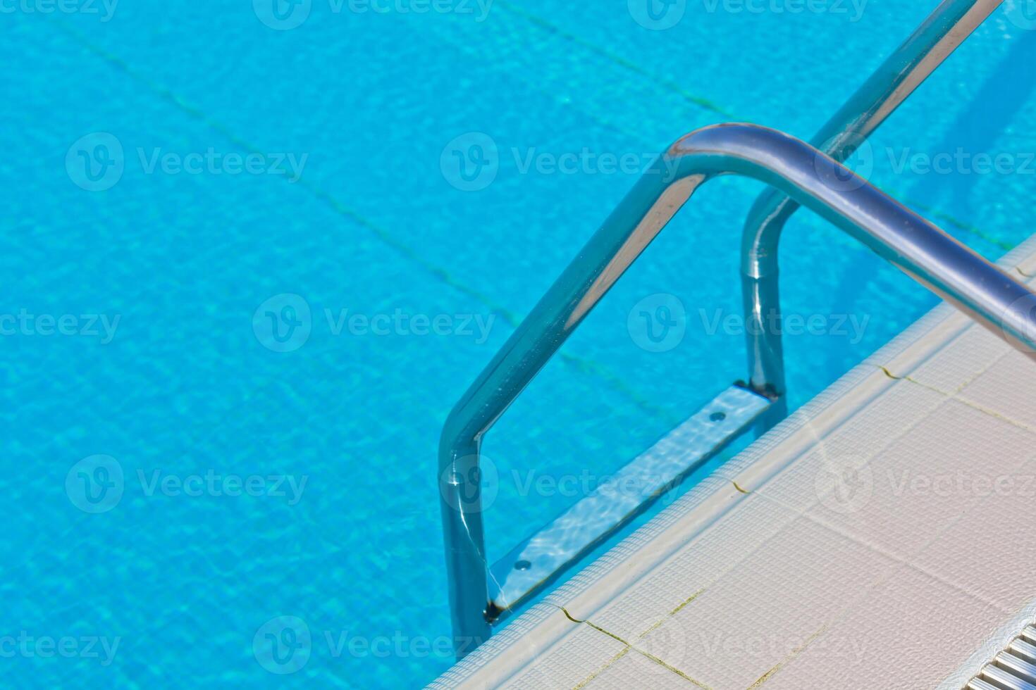 Ladder of a swimming pool photo