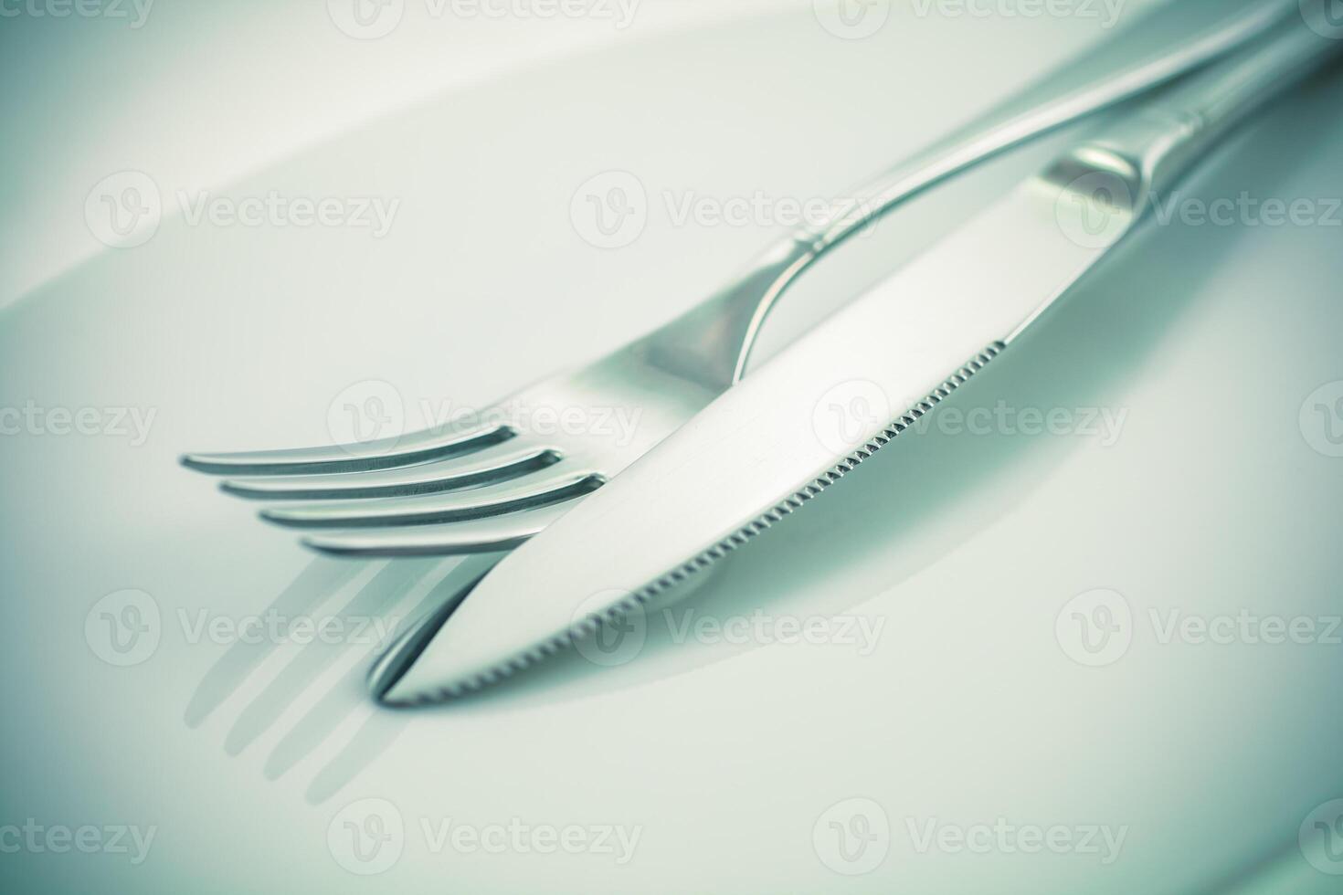 Fork and knife on a white background photo