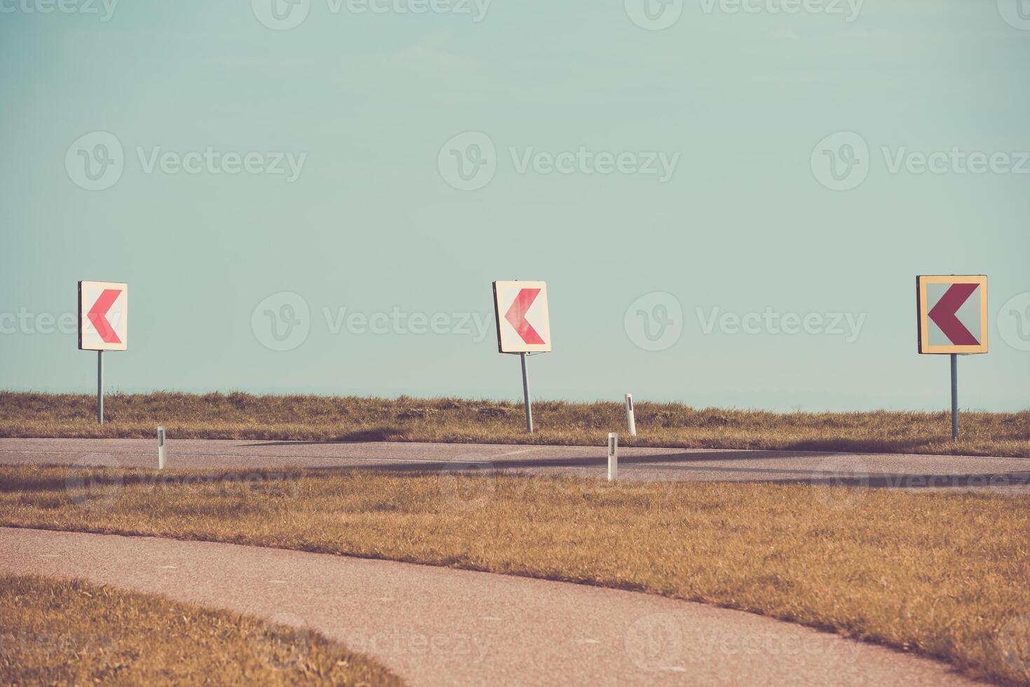Turn left sign on a country road photo