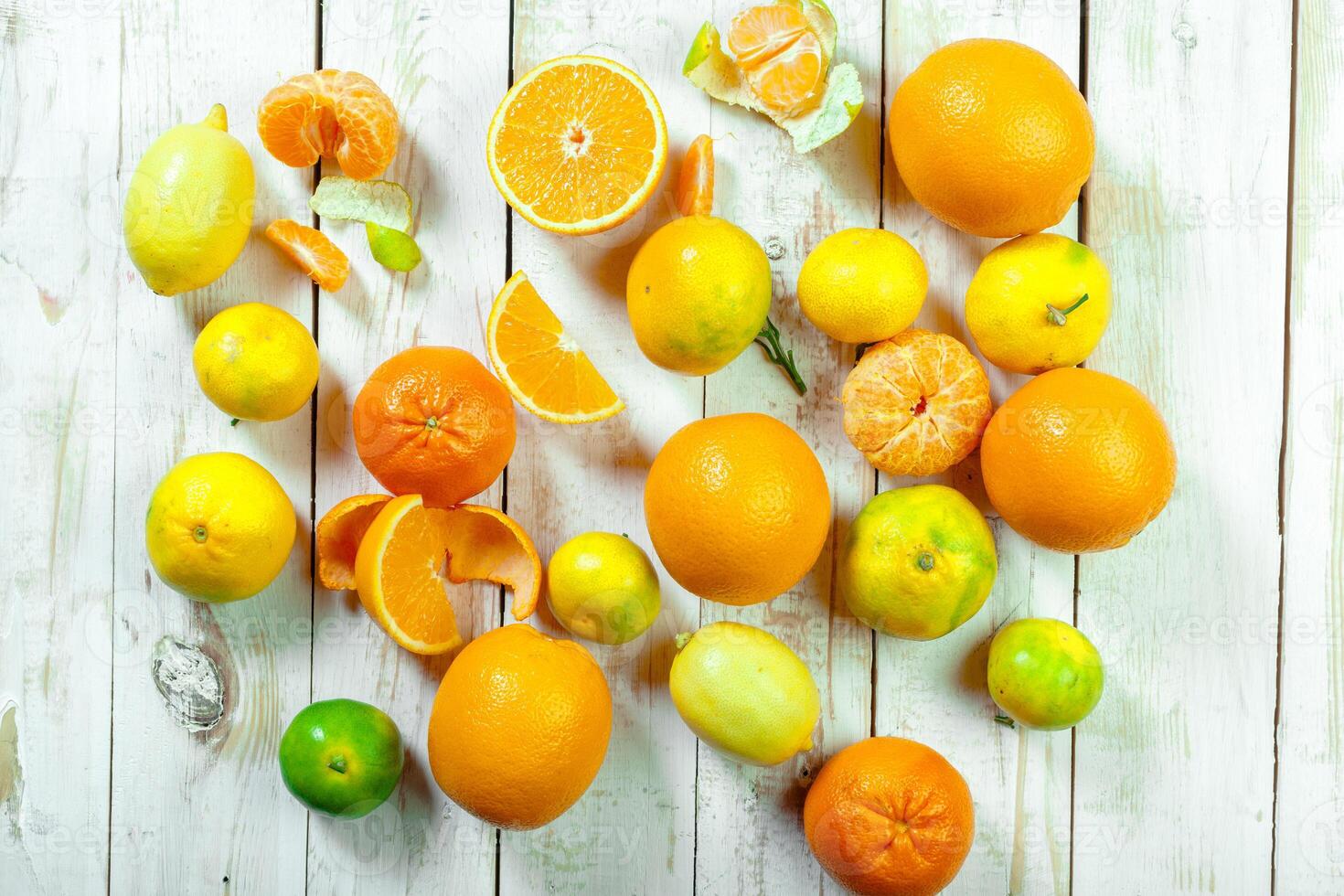 Citrus fresh fruit on the white wooden table photo