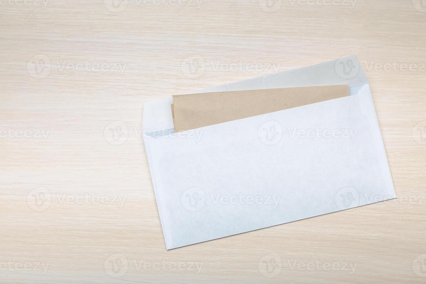 Photo of blank envelope on a wooden background