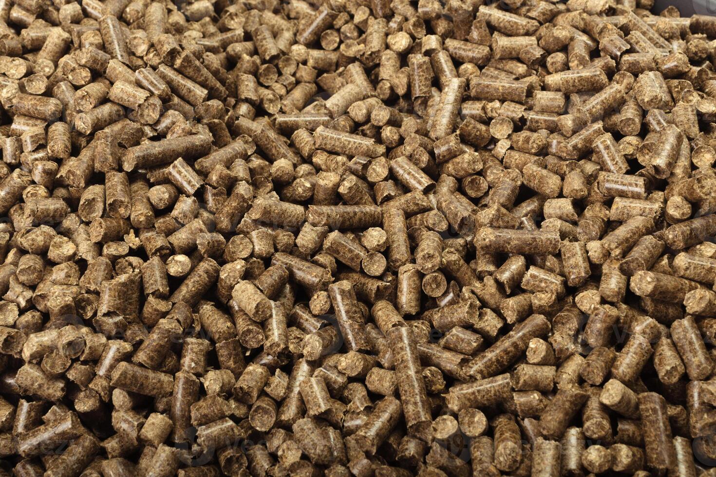 Wood pellets in the background. photo