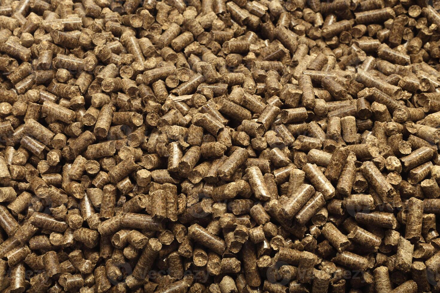 Wood pellets in the background. photo