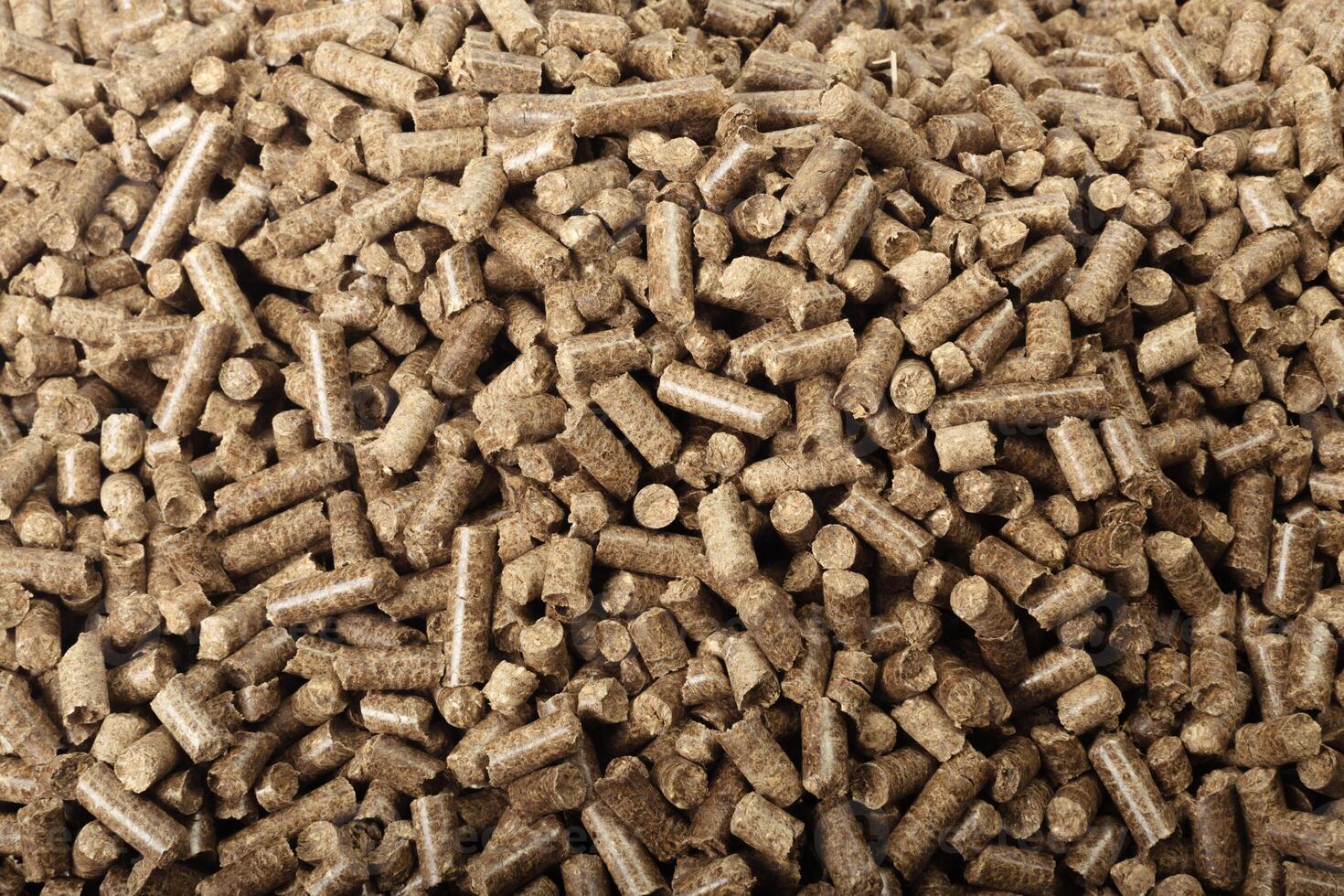 Wood pellets in the background. photo