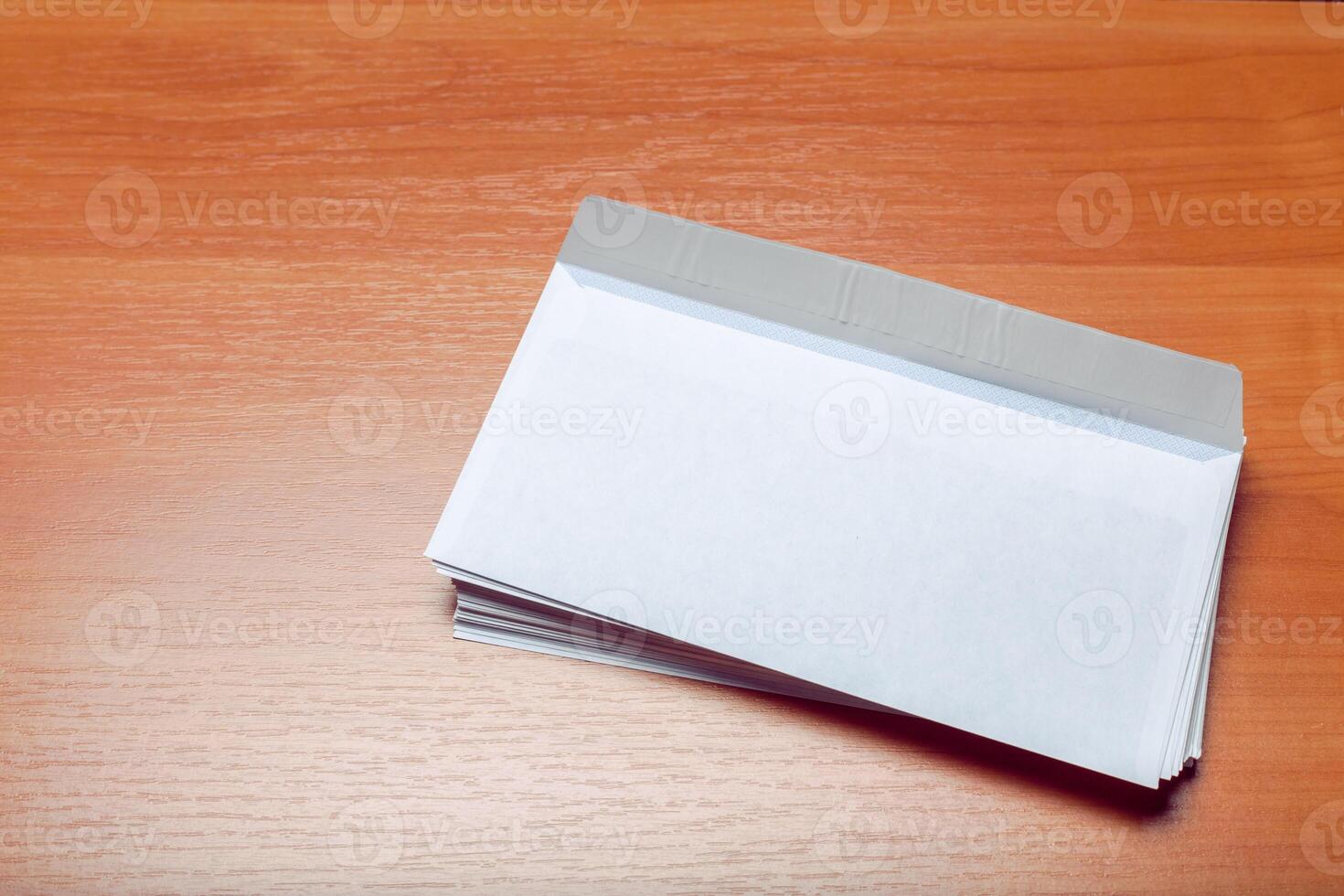Photo of blank envelope on a wooden background