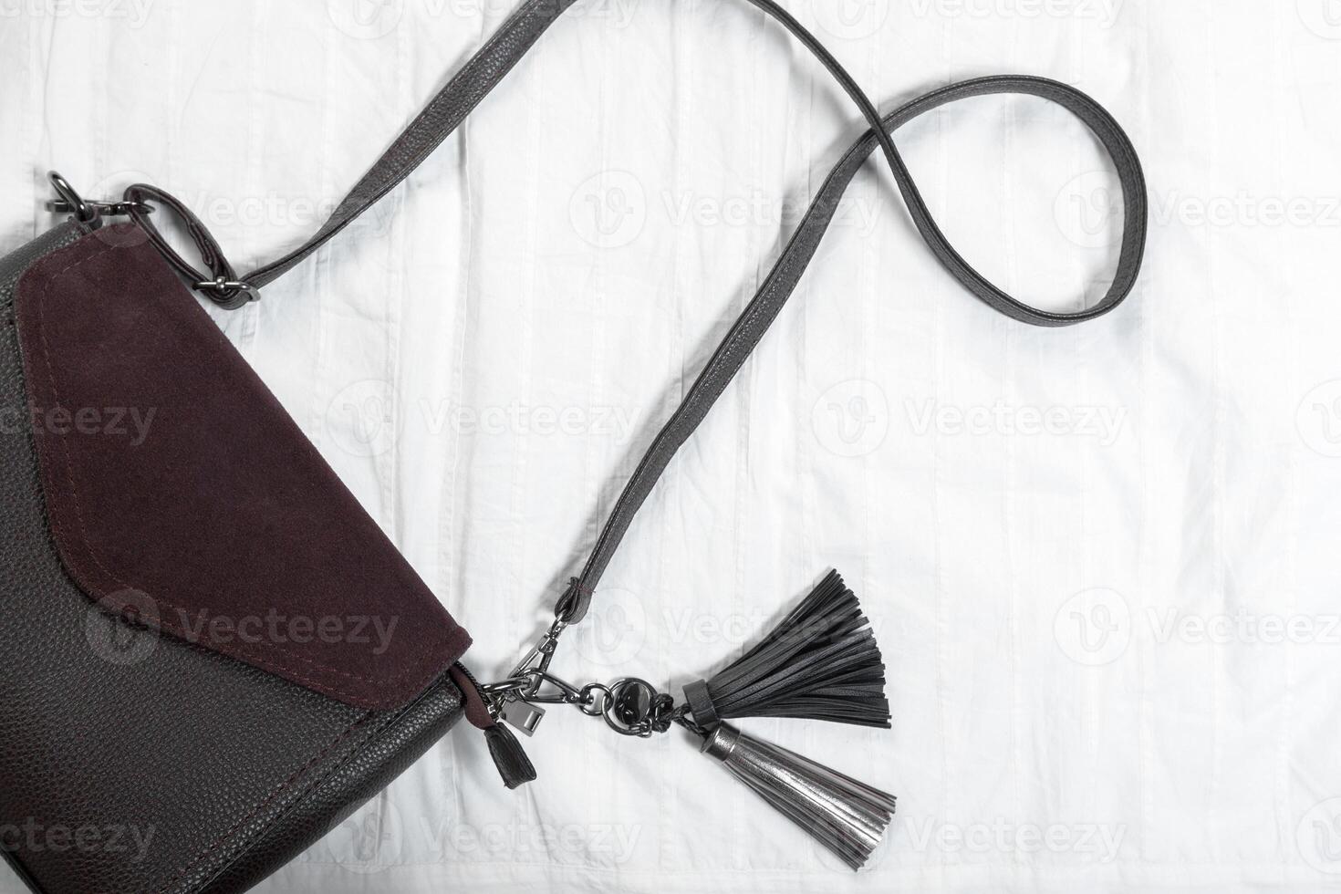 Female bag on white textile photo