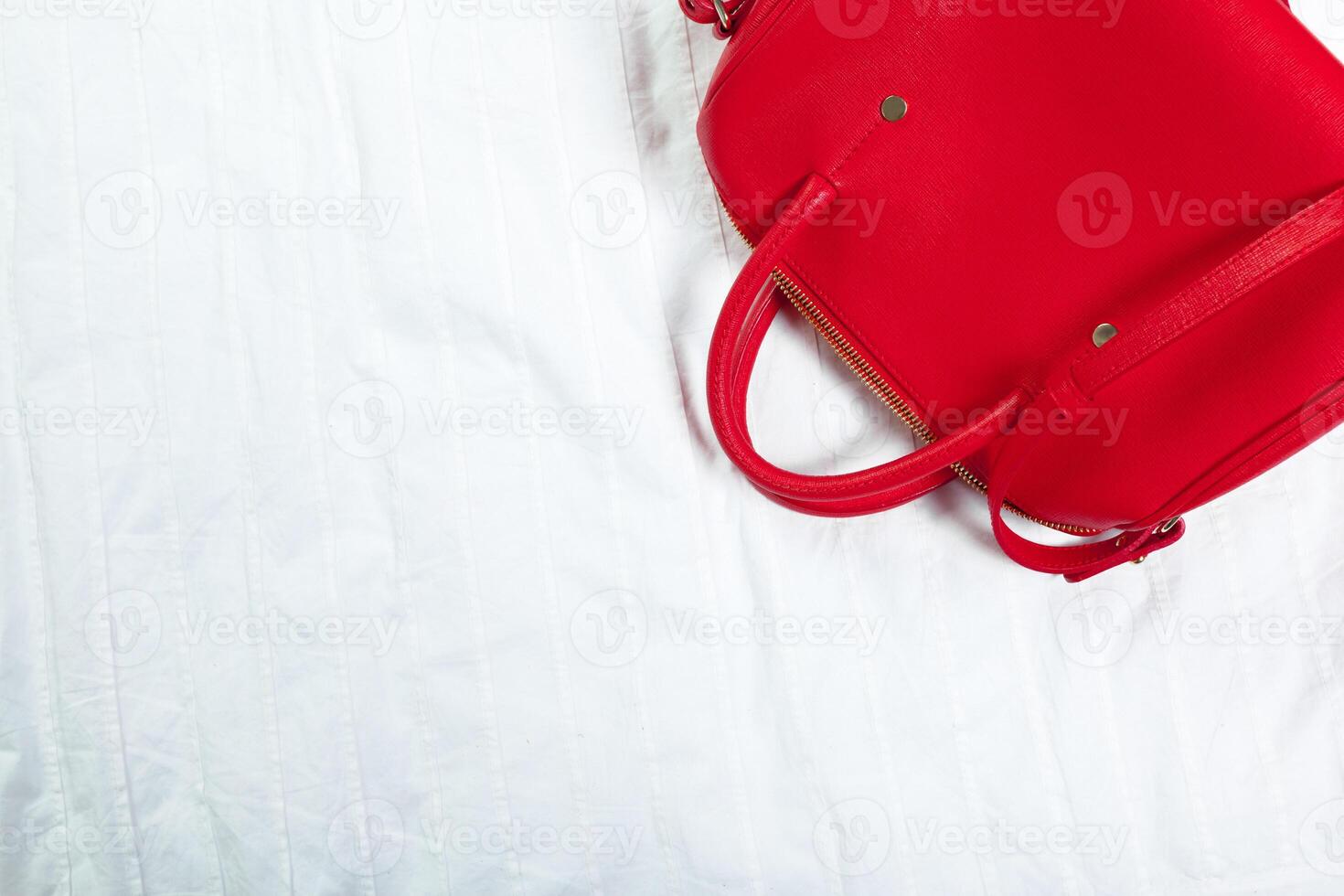 Female bag on white textile photo
