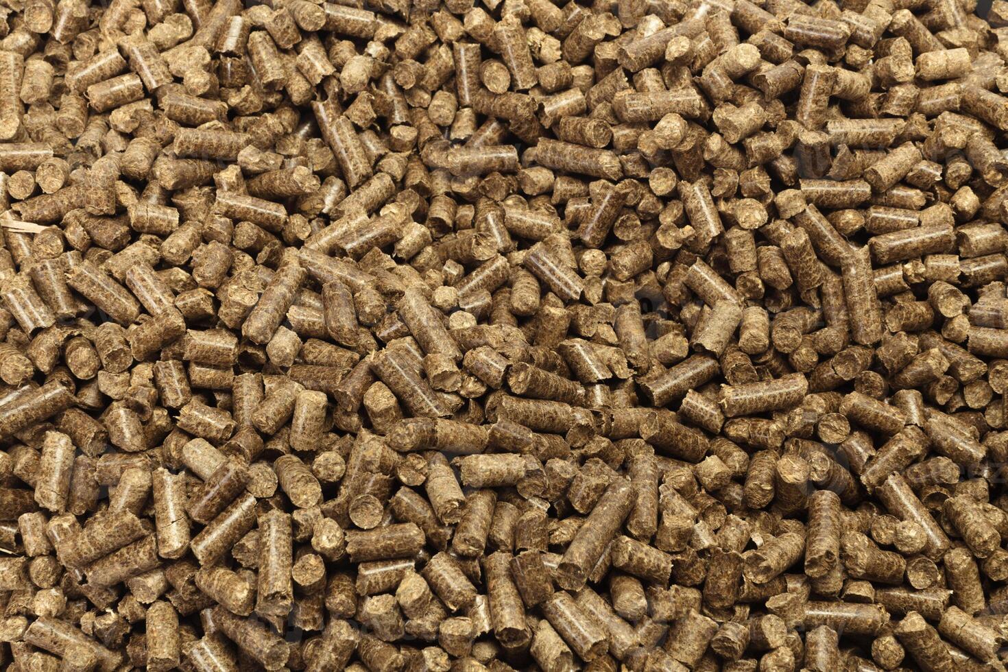 Wood pellets in the background. photo